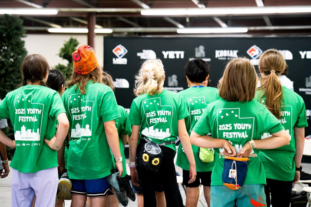 Young climbers and families together at a USA Climbing event